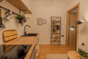 a kitchen with a sink and a counter at The Uppertown Nest - By Urban Minds in Thessaloniki