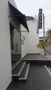 a building with awning on the side of it at Hotel Boutique Santorini Class in Sincelejo