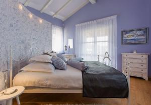 Postel nebo postele na pokoji v ubytování Villa Stupenda