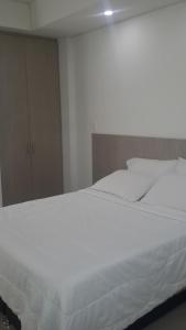 Hotel Boutique Santorini Class客房内的一张或多张床位
