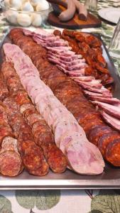 a tray of meats and sausages on a table at Barangoló vendégház in Bárdudvarnok