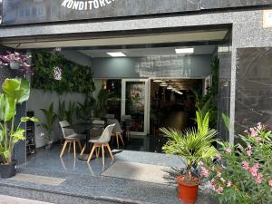 a restaurant with a table and chairs and plants at City Hotel Storch in Cologne