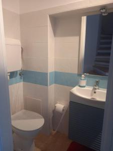 a bathroom with a toilet and a sink at SEA HOUSE Casa Vacanze in Francavilla al Mare +6 photos