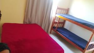 Voodi või voodid majutusasutuse Hospedagem Tia Dete toas