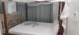 Postel nebo postele na pokoji v ubytování Angel Luxury Homes Kijani