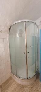 a shower with a glass door in a bathroom at La roche in Rochemaure