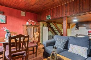 a living room with a blue couch and a table at Montegrande rodeado de montañas in Páramo +15 photos