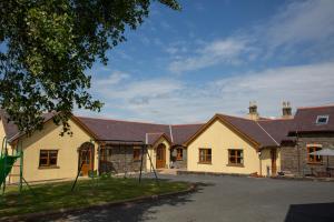 a row of houses with roofs at Aberystwyth Enlli Cottage in Llanilar