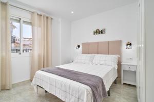 Ένα ή περισσότερα κρεβάτια σε δωμάτιο στο Apartamento Suzanne