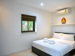 Ένα ή περισσότερα κρεβάτια σε δωμάτιο στο Chaweng Hill 2br & Private Pool +11 φωτογραφίες