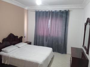 Ένα ή περισσότερα κρεβάτια σε δωμάτιο στο Appartement Tanger centre centro