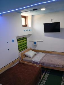 Ένα ή περισσότερα κρεβάτια σε δωμάτιο στο Retro II