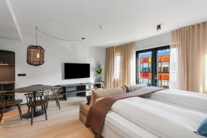 a hotel room with a bed and a table at Strand Hotel Apartments in Hafnarfjördur