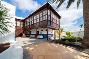 an exterior view of a house with a building at La Casona de Yaiza I Hotel Emblematico in Yaiza