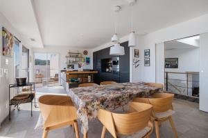 a kitchen and dining room with a table and chairs at Dream Vacation In A Beautiful Villa in Cerbère