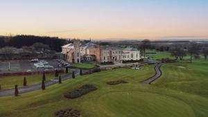 an aerial view of a large house with a green yard at Glenlo Abbey Hotel in Galway