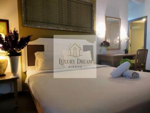 Ένα ή περισσότερα κρεβάτια σε δωμάτιο στο Luxury Dream Seaview