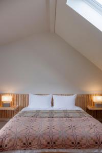 Ένα ή περισσότερα κρεβάτια σε δωμάτιο στο Brackenfell Lodge
