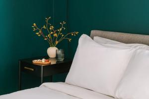 Postel nebo postele na pokoji v ubytování Roami at Duncan Plaza + 15 fotografií