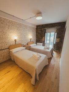 Ένα ή περισσότερα κρεβάτια σε δωμάτιο στο Go Compostela Apartamento 4 pax +19 φωτογραφίες