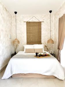 a bedroom with a white bed and two lamps at Apartment in villa - RELAXING POOL-FRONT, PRIVATE TERRACE & POOL ACCESS, SOUTH TENERIFE in Arona