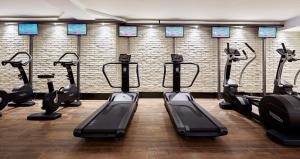 a gym with treadmills and ellipticals in a room at Delamar 4*Sup-Adults only (18+) in Lloret de Mar