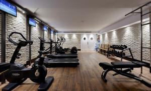 a gym with treadmills and exercise bikes in a room at Delamar 4*Sup-Adults only (18+) in Lloret de Mar