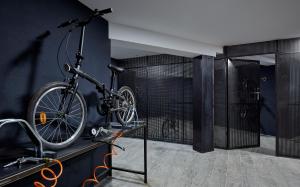 a bike hanging on a wall in a room at Delamar 4*Sup-Adults only (18+) in Lloret de Mar