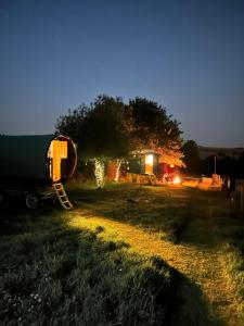 a truck parked in a field at night at The gypsy wagon in Berwick Saint John