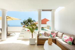 a living room with a couch and a view of the ocean at Exclusive Villa FRANJULY Playa Paraiso Ocean View Private Pool Large Terrace in Adeje