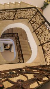 a stairway with a mirror on the wall at Hotel Evia in Eforie Nord