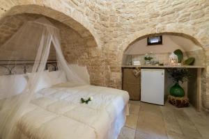 Posteľ alebo postele v izbe v ubytovaní Trulli Family - Trulli&Cummerse