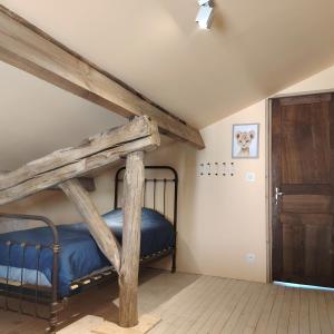 Ένα ή περισσότερα κρεβάτια σε δωμάτιο στο Le Goire at Le Maingaud