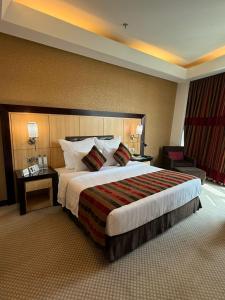 Ένα ή περισσότερα κρεβάτια σε δωμάτιο στο Dancenter Hotel Near Business Center Al Olaya