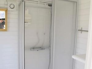a shower with a glass door in a bathroom at 4 person holiday home in Stege-By Traum in Pollerup Kullegård +5 photos
