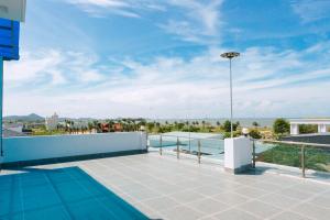 a balcony with a view of the ocean at Sunny Villa Hà Tiên in Ha Tien