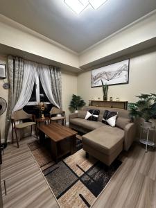 a living room with a couch and a table at Marexe in Tabok +56 photos