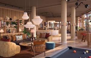 a lobby with couches and a pool table at The Dock in Södertälje