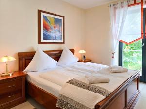 Postel nebo postele na pokoji v ubytování Villa Friede-Marie, Penthouse Lenea und Sophie + 27 fotografií