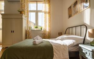 Ένα ή περισσότερα κρεβάτια σε δωμάτιο στο AB Apartamenty Rzeszów Train Station
