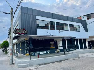 a building with a sign for a restaurant at GM Suites in Cúcuta