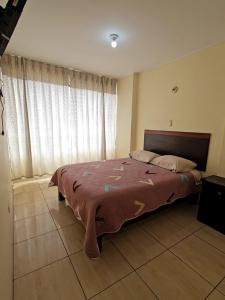 Ένα ή περισσότερα κρεβάτια σε δωμάτιο στο hostal posada del sol