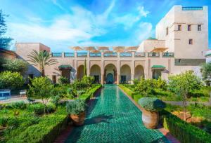 a courtyard of a building with a swimming pool at Elite Escape - Marrakech Centre in Marrakech
