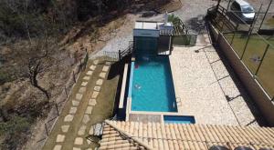 an overhead view of a swimming pool in a backyard at Fazenda Dos Milagres in Santana do Riacho