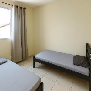 Voodi või voodid majutusasutuse Prático Assis - Arena MRV - Com Garagem toas