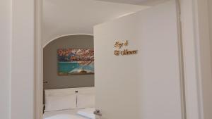 a room with a bed and a painting on the wall at Cà Dossa in Padergnone +22 photos