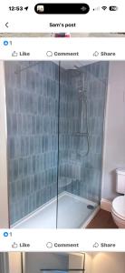 a screenshot of a bathroom with a shower and a toilet at The Osborne in Shanklin +30 photos