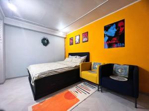 a room with a bed and a couch in it at CASA NANACINE Center of Seoul Itaewon, Myungdong, Namsan in Seoul