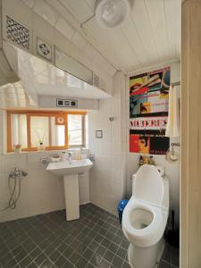 a bathroom with a toilet and a sink at CASA NANACINE Center of Seoul Itaewon, Myungdong, Namsan in Seoul +23 photos