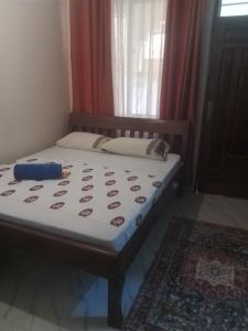 Una cama o camas en una habitación de Taifa in bnb